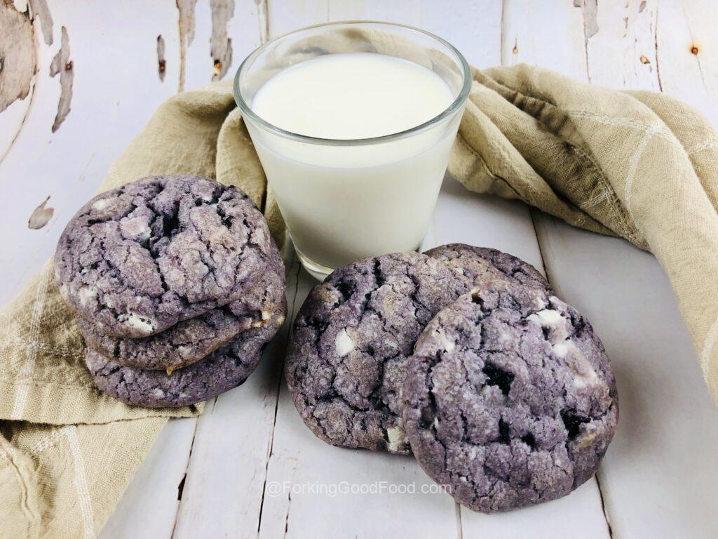 blueberry white chocolate cookies with milk and towel