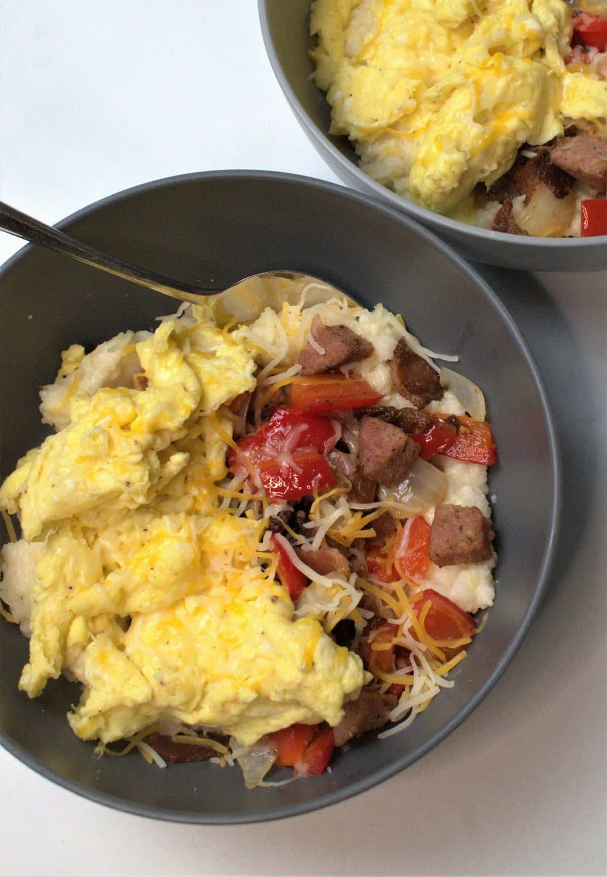 bowl of grits with eggs and meat