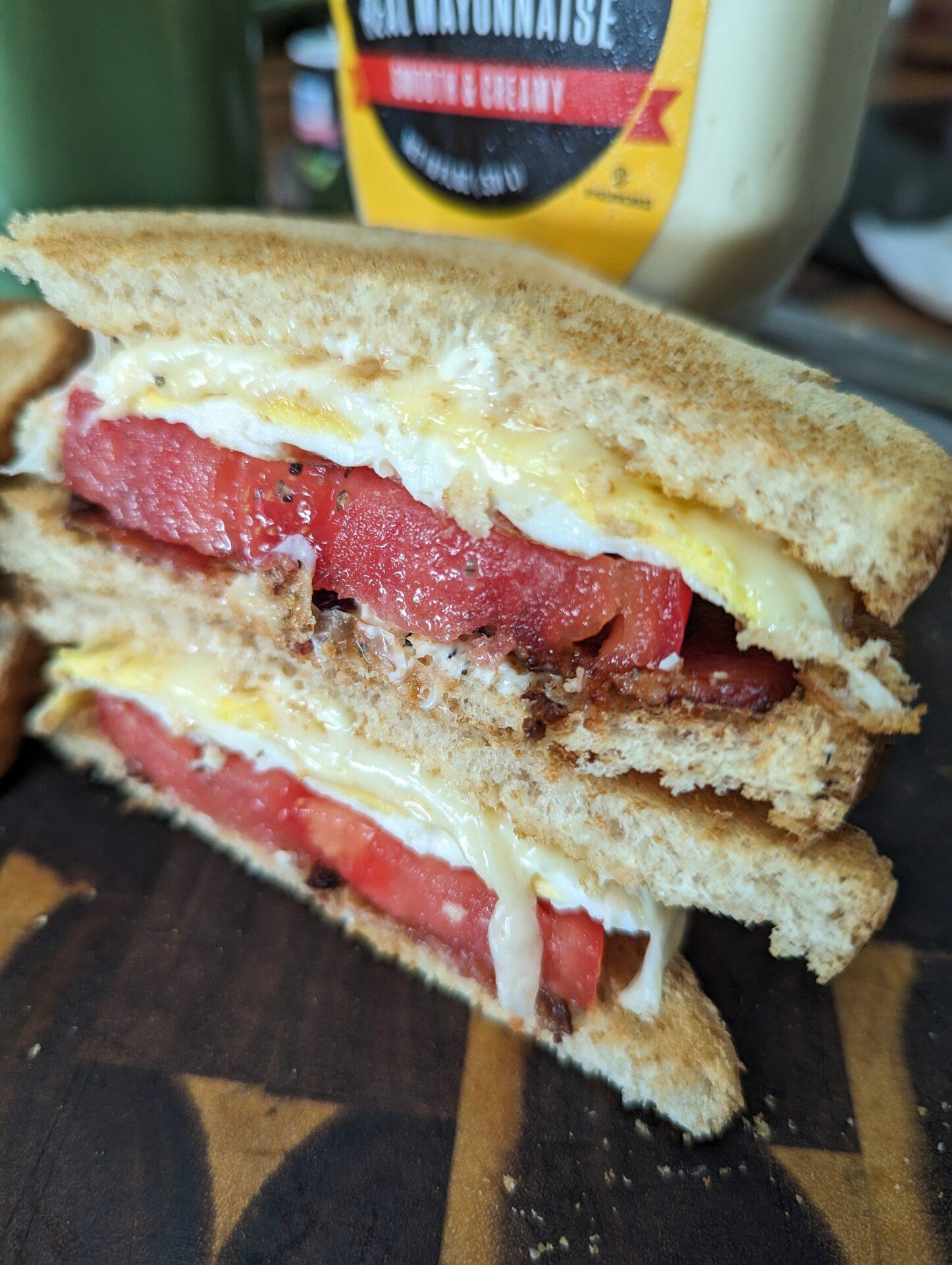 fried egg tomato sandwich sliced